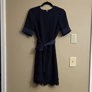 Elegant Navy Dress with Lace Hem